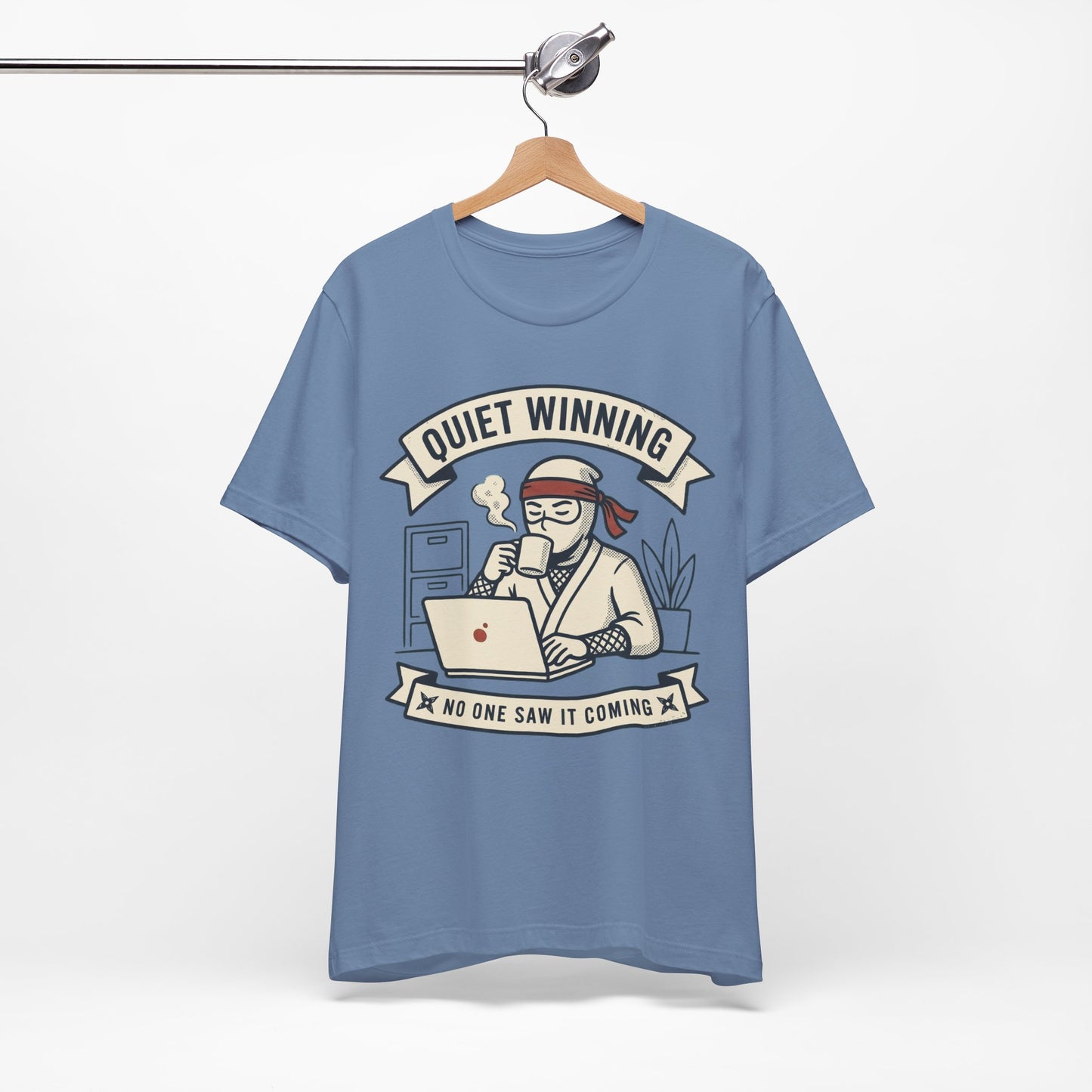 Natural Bella+Canvas 3001 unisex tee with Quiet Winning ninja laptop design, flat lay
