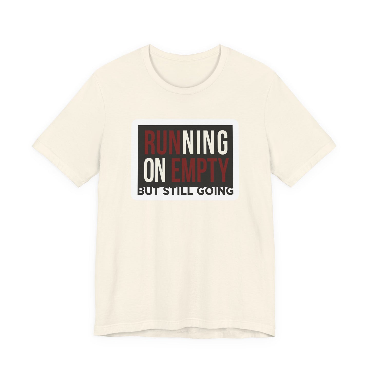 Natural Bella+Canvas 3001 unisex tee with Running on Empty But Still Going graphic, on hanger