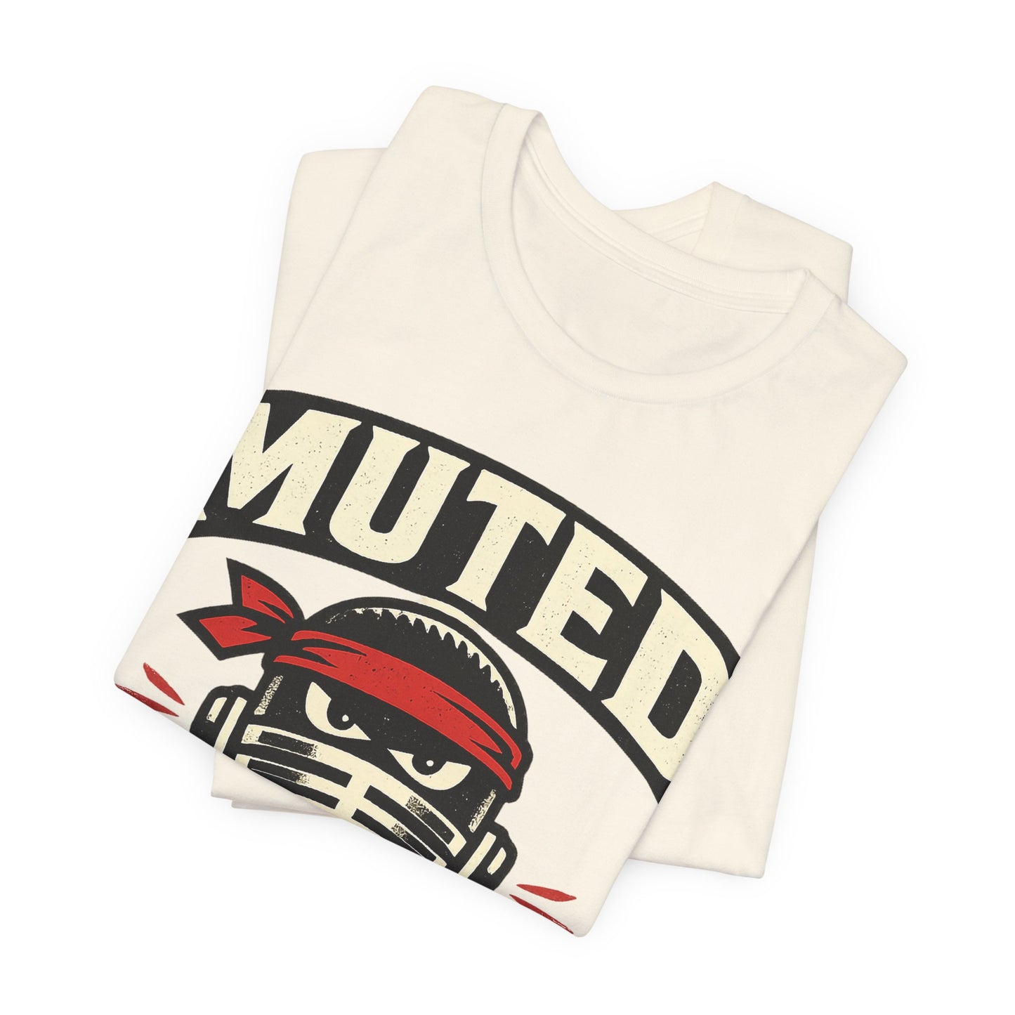 Natural Bella+Canvas 3001 unisex tee with Muted But Dangerous ninja graphic, flat lay