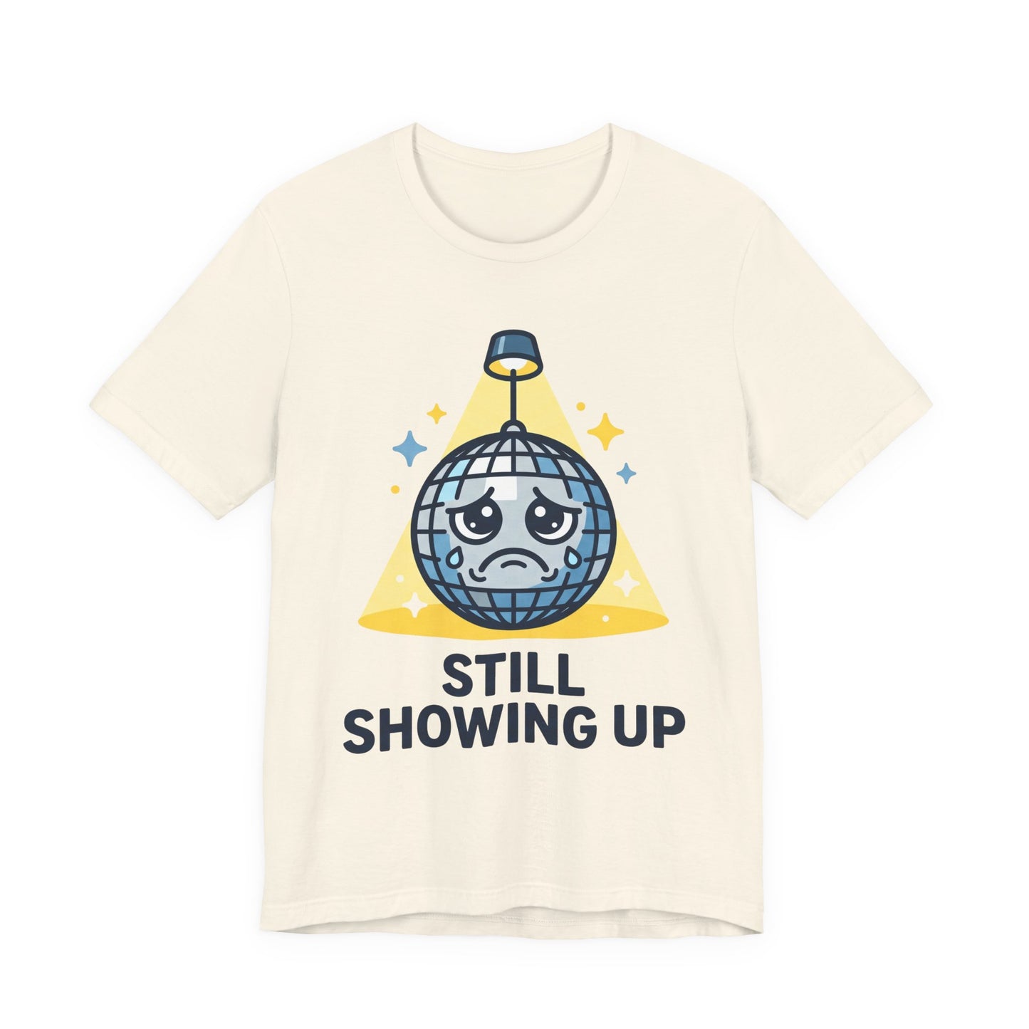 Natural Bella+Canvas 3001 unisex tee with Still Showing Up graphic, on hanger
