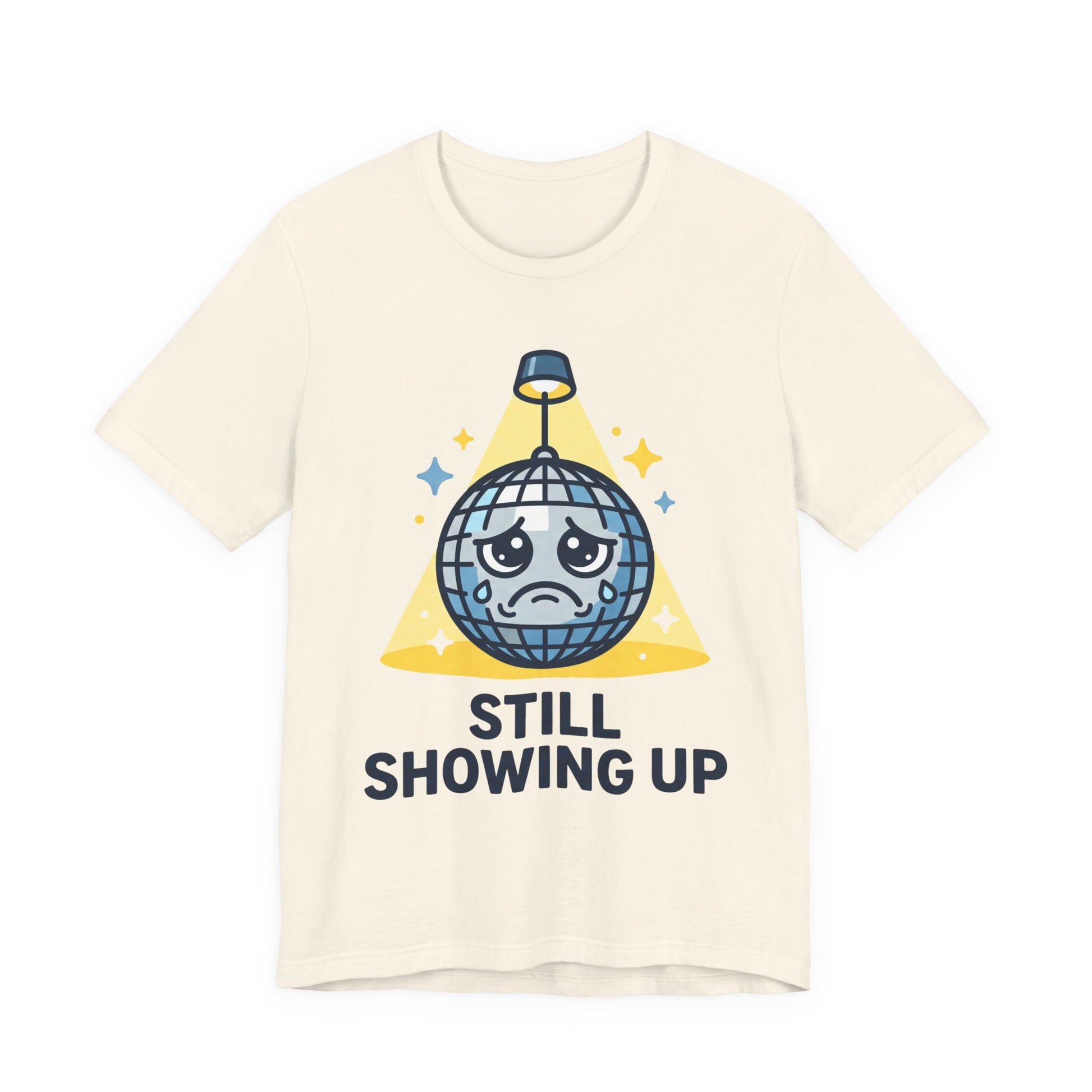 Natural Bella+Canvas 3001 unisex tee with Still Showing Up graphic, on hanger