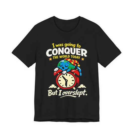Black Bella+Canvas 3001 unisex tee with I Was Going to Conquer the World But I Overslept graphic, flat lay