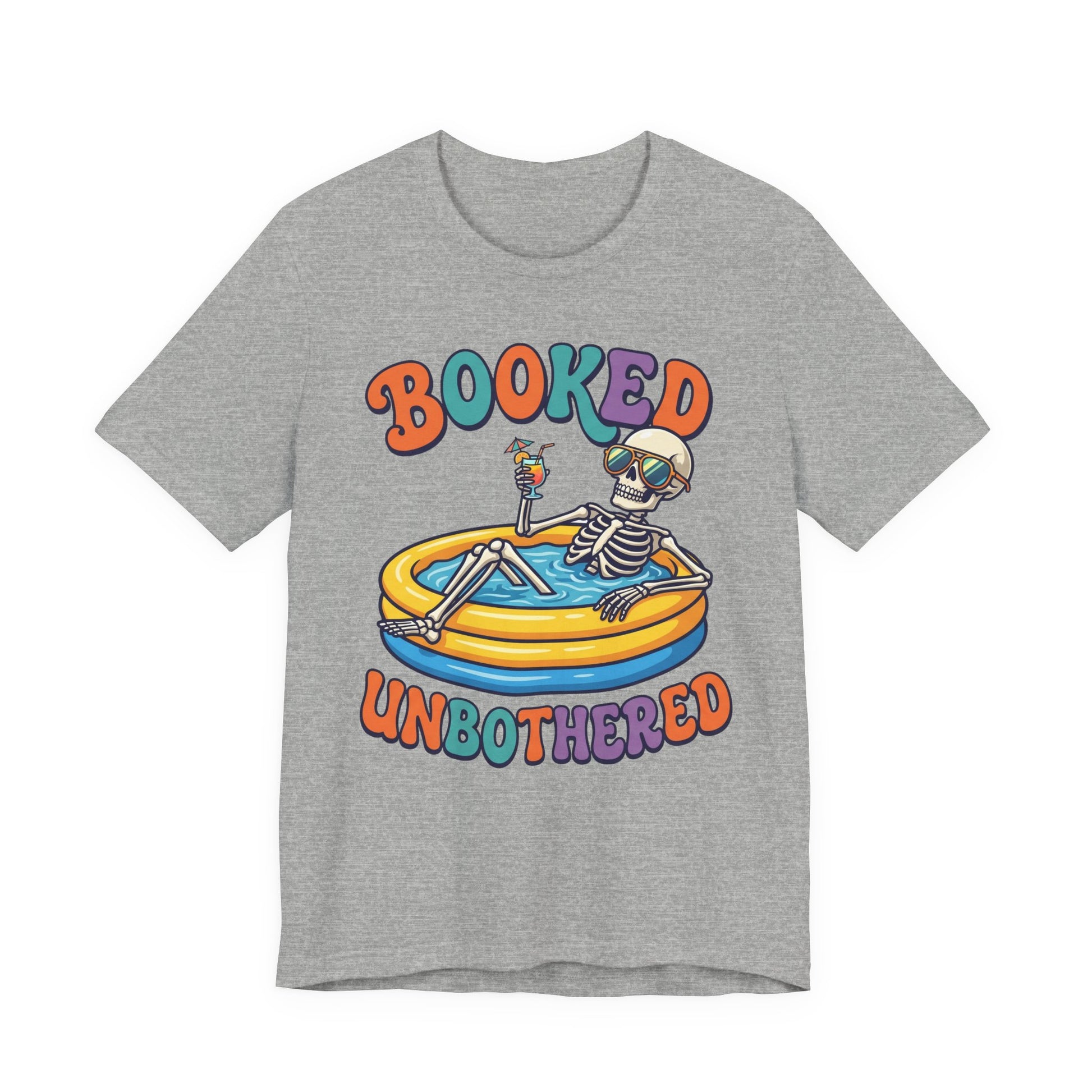 Natural Bella+Canvas 3001 unisex tee with Booked and Unbothered graphic, flat lay