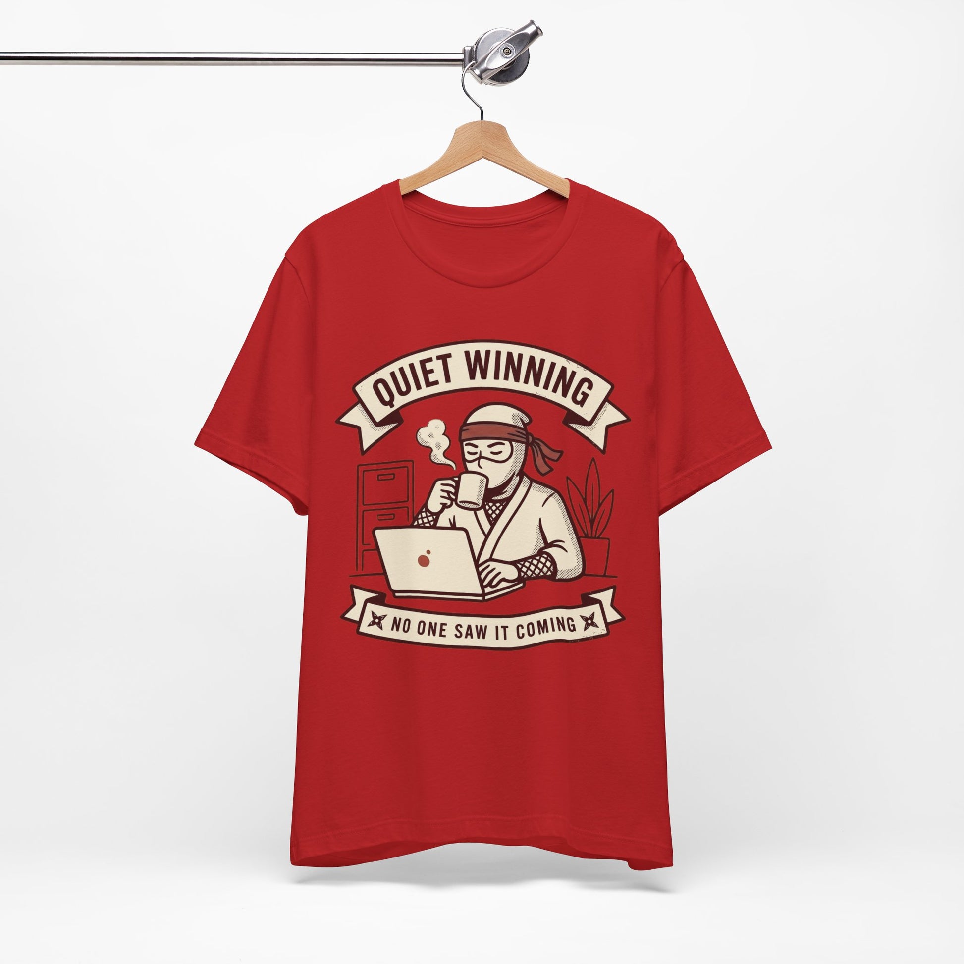 Natural Bella+Canvas 3001 unisex tee with Quiet Winning ninja laptop design, on hanger