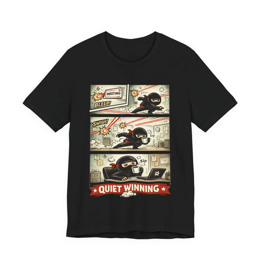 Black Bella+Canvas 3001 unisex tee with Quiet Winning ninja comic strip graphic, flat lay