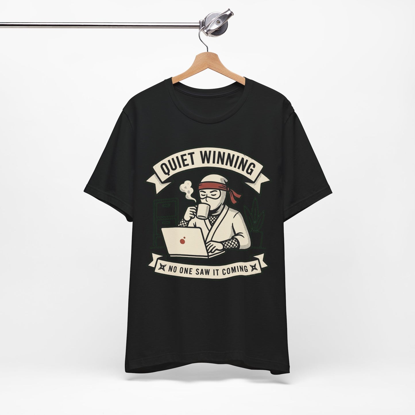 Natural Bella+Canvas 3001 unisex tee with Quiet Winning ninja laptop design, flat lay