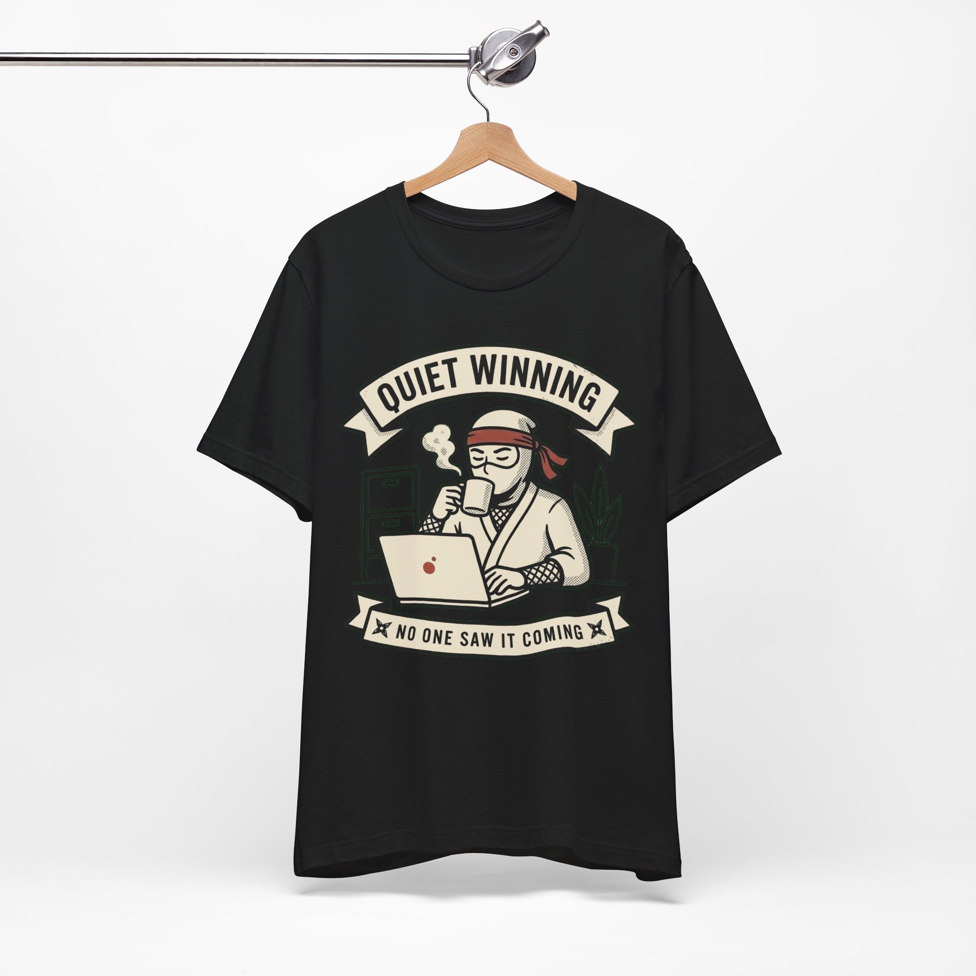Natural Bella+Canvas 3001 unisex tee with Quiet Winning ninja laptop design, flat lay