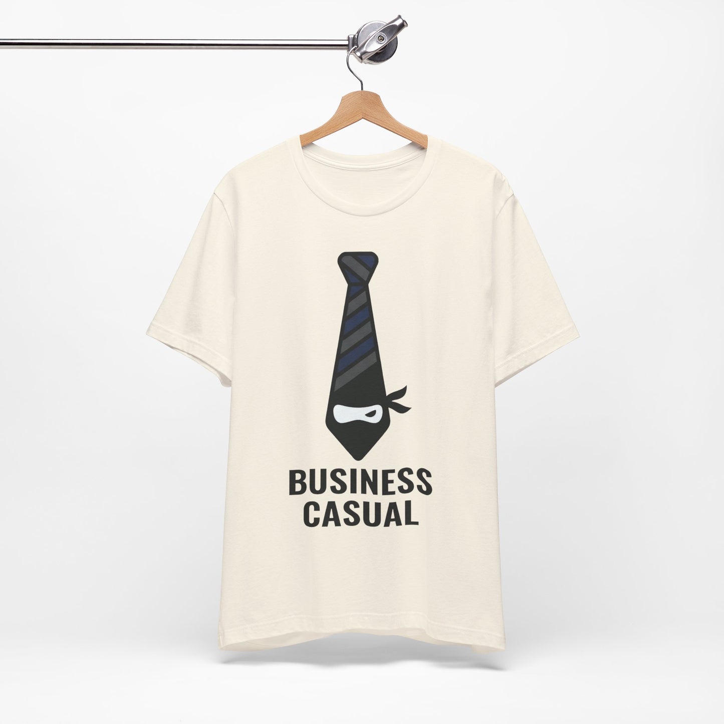 Natural Bella+Canvas 3001 unisex tee with Business Casual ninja in tie graphic, on hanger