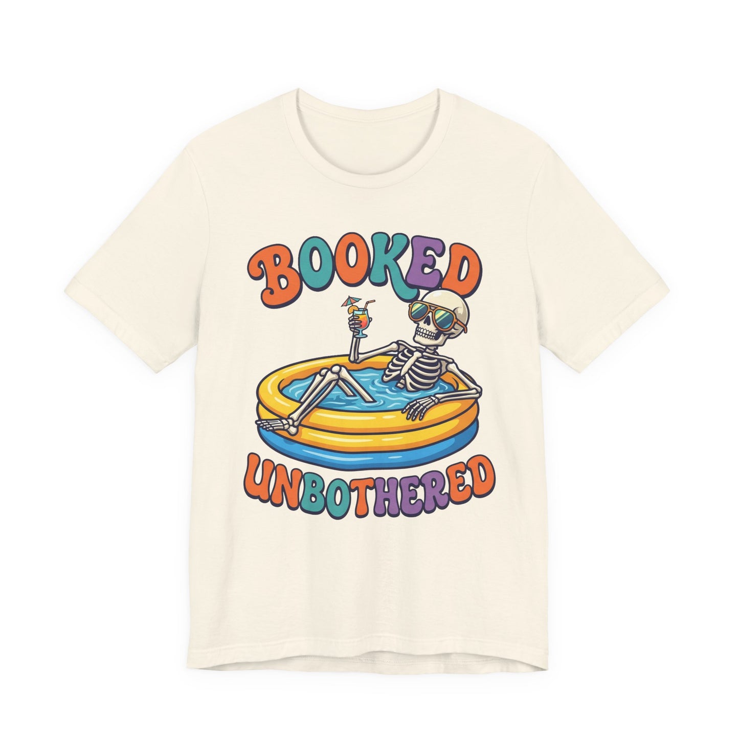 Natural Bella+Canvas 3001 unisex tee with Booked and Unbothered graphic, on hanger