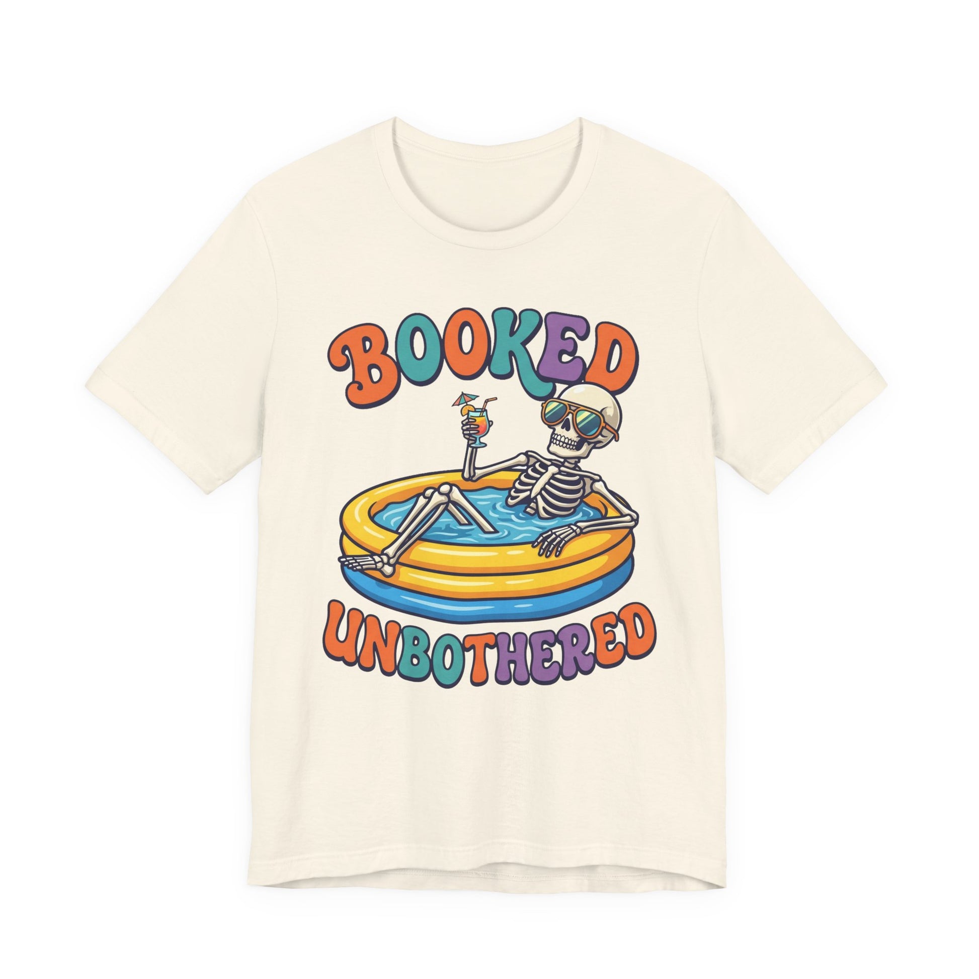 Natural Bella+Canvas 3001 unisex tee with Booked and Unbothered graphic, on hanger