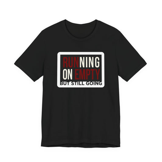 Black Bella+Canvas 3001 unisex tee with Running on Empty But Still Going graphic, flat lay