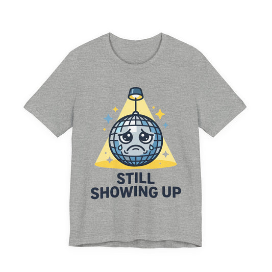 Natural Bella+Canvas 3001 unisex tee with Still Showing Up graphic, flat lay