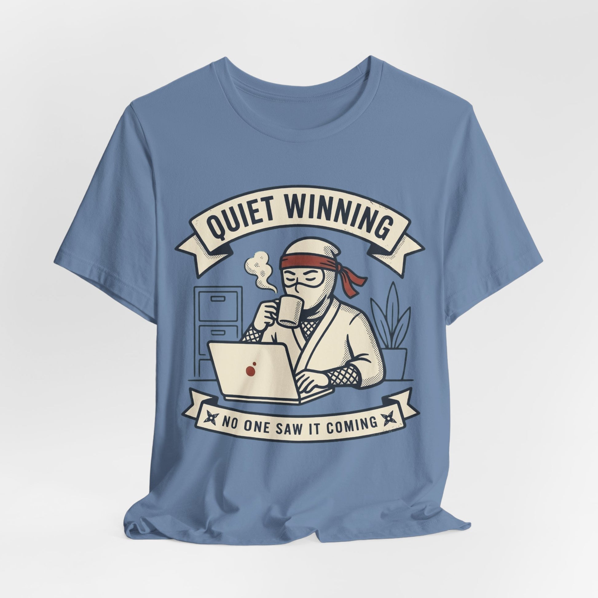 Black Bella+Canvas 3001 unisex tee with Quiet Winning ninja laptop design, on hanger
