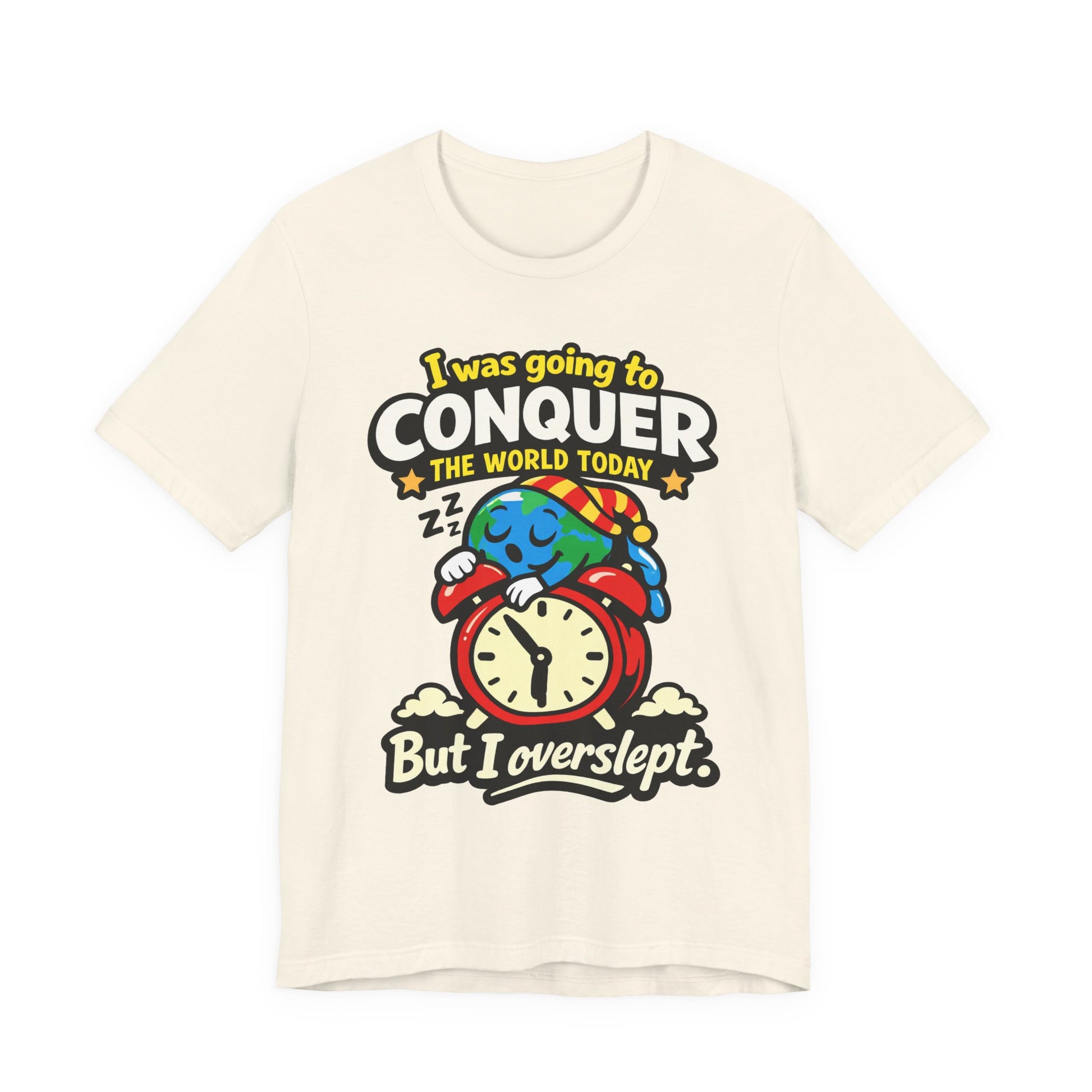 Natural Bella+Canvas 3001 unisex tee with I Was Going to Conquer the World But I Overslept graphic, on hanger