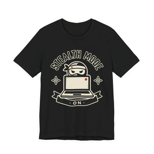 Black Bella+Canvas 3001 unisex tee with Stealth Mode On ninja laptop badge graphic, flat lay