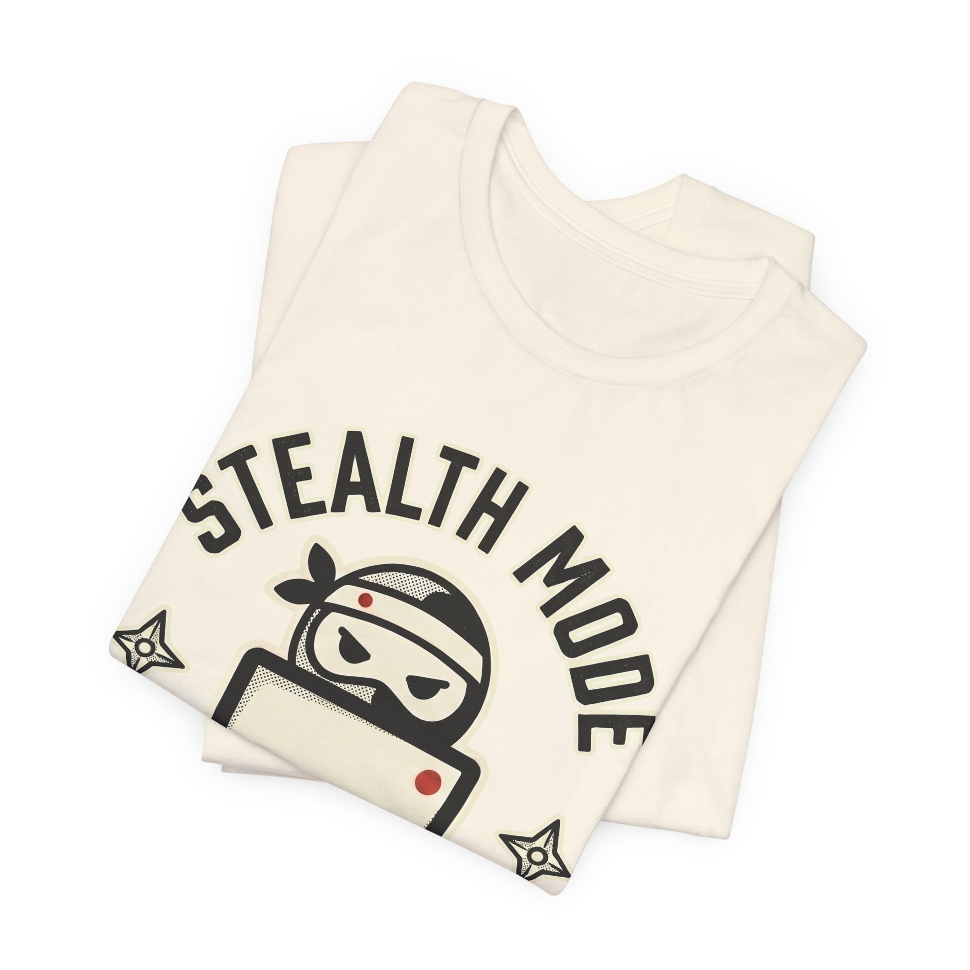 Natural Bella+Canvas 3001 unisex tee with Stealth Mode On ninja laptop badge graphic, on hanger