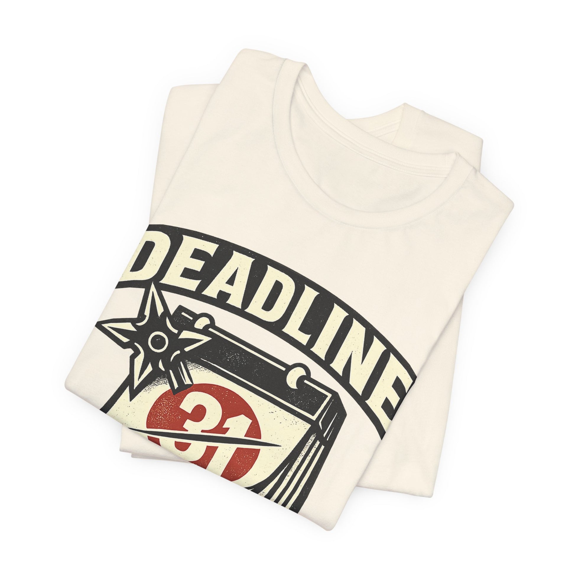 Natural Bella+Canvas 3001 unisex tee with Deadline Eliminated ninja badge graphic, folded