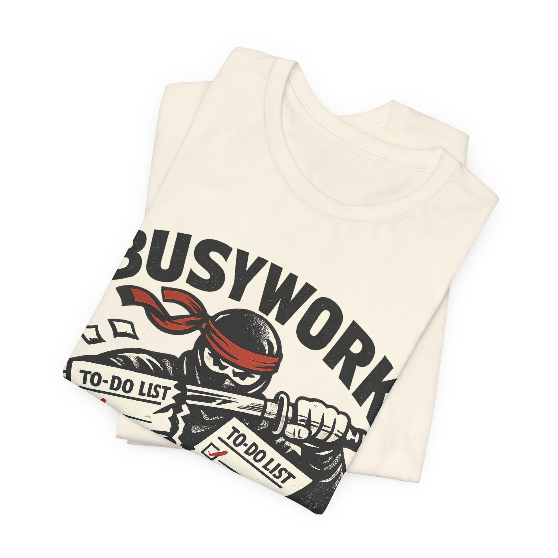 Natural Bella+Canvas 3001 unisex tee with Busywork Sliced ninja slicing to-do lists graphic, flat lay