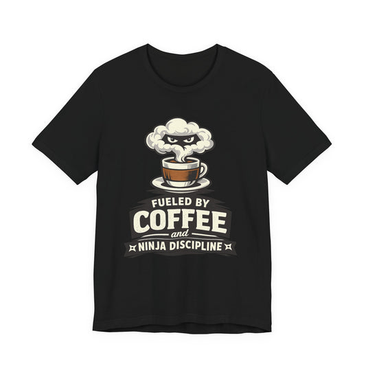 Black Bella+Canvas 3001 unisex tee with Fueled by Coffee and Ninja Discipline cup badge graphic, flat lay