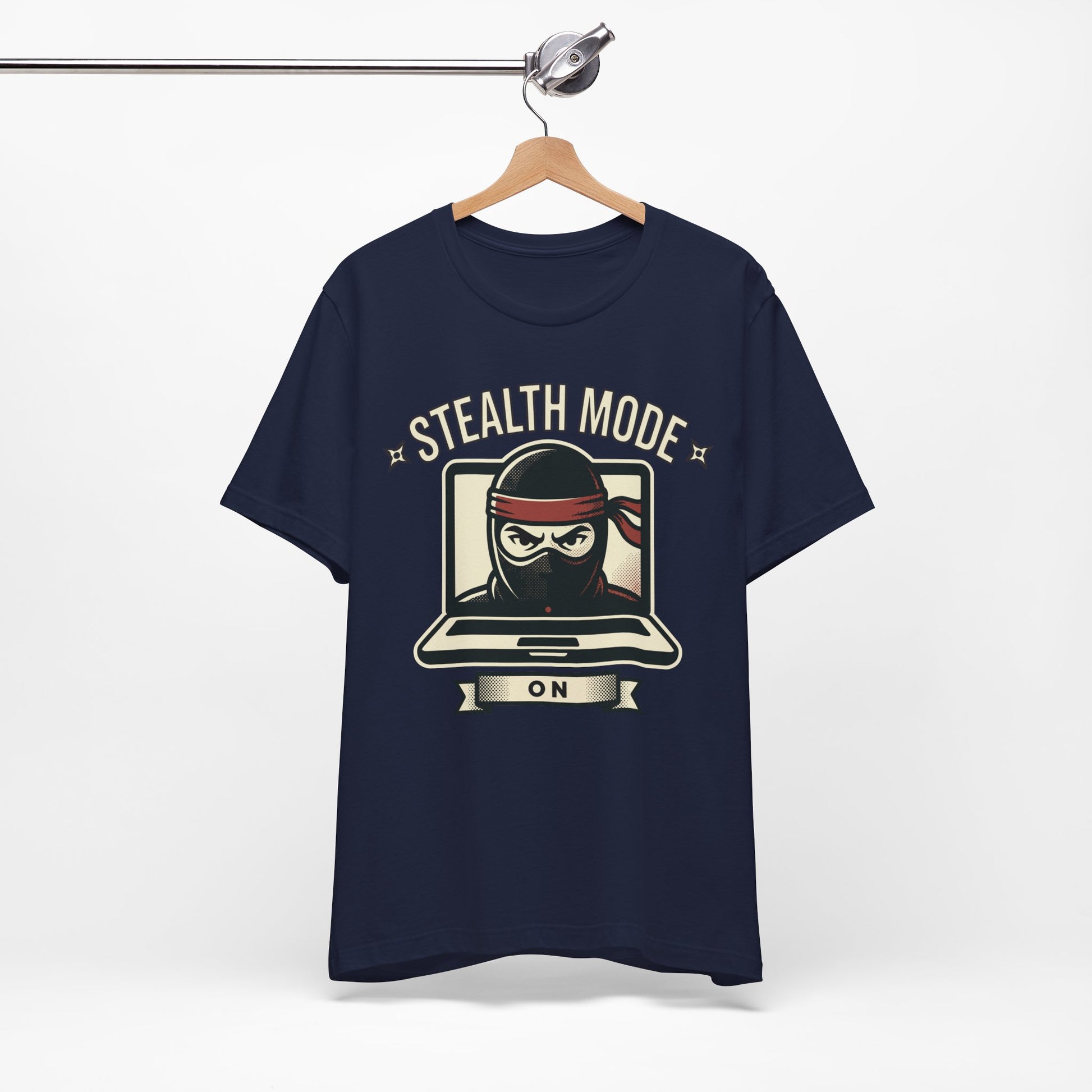 Steel Blue Bella+Canvas 3001 unisex tee with Stealth Mode On ninja laptop graphic, flat lay