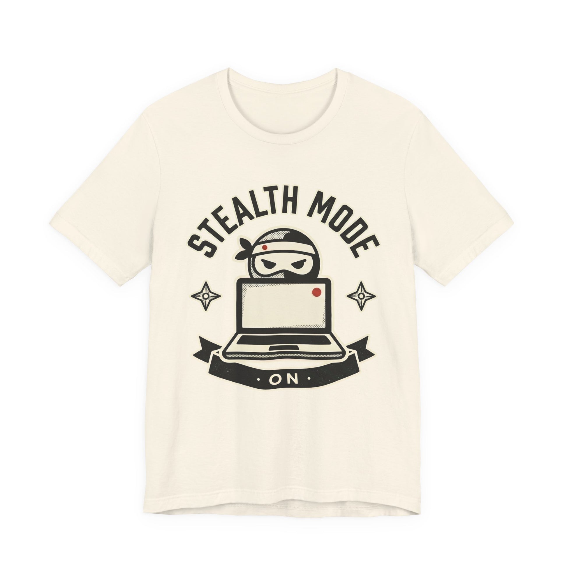Natural Bella+Canvas 3001 unisex tee with Stealth Mode On ninja laptop badge graphic, flat lay