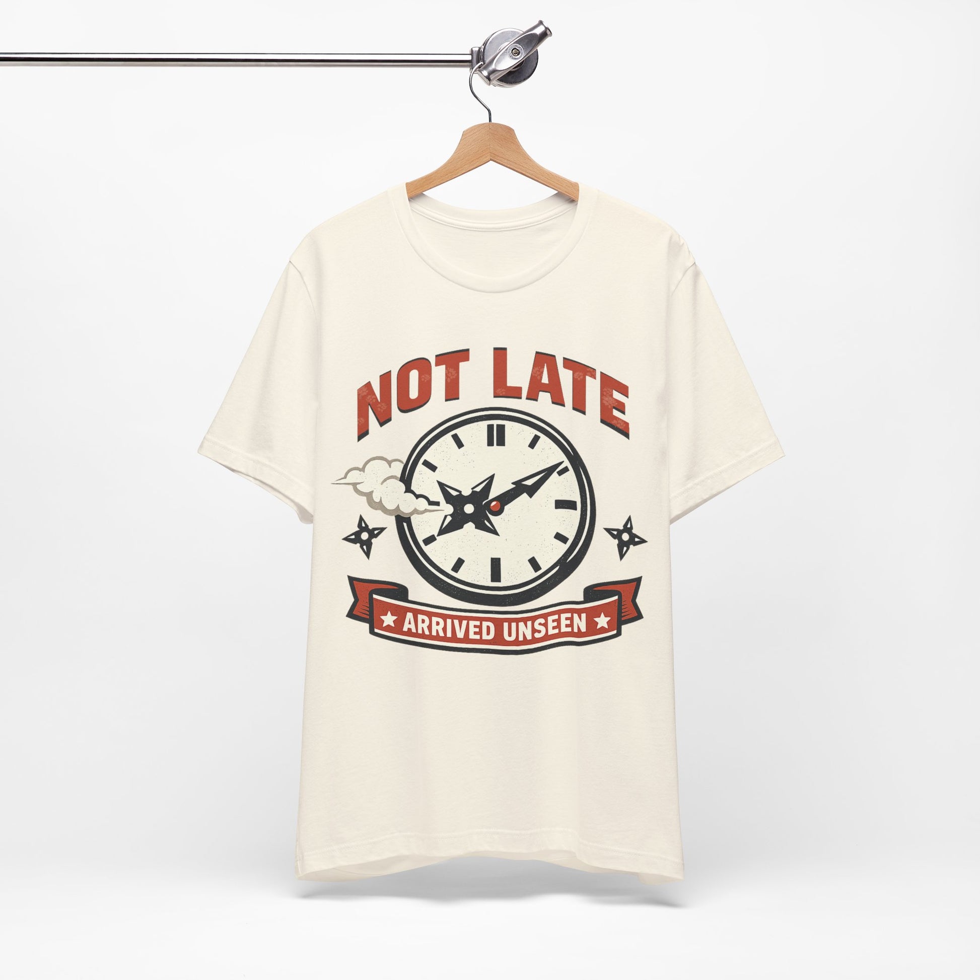 Red Bella+Canvas 3001 unisex tee with Not Late Arrived Unseen ninja clock design, flat lay